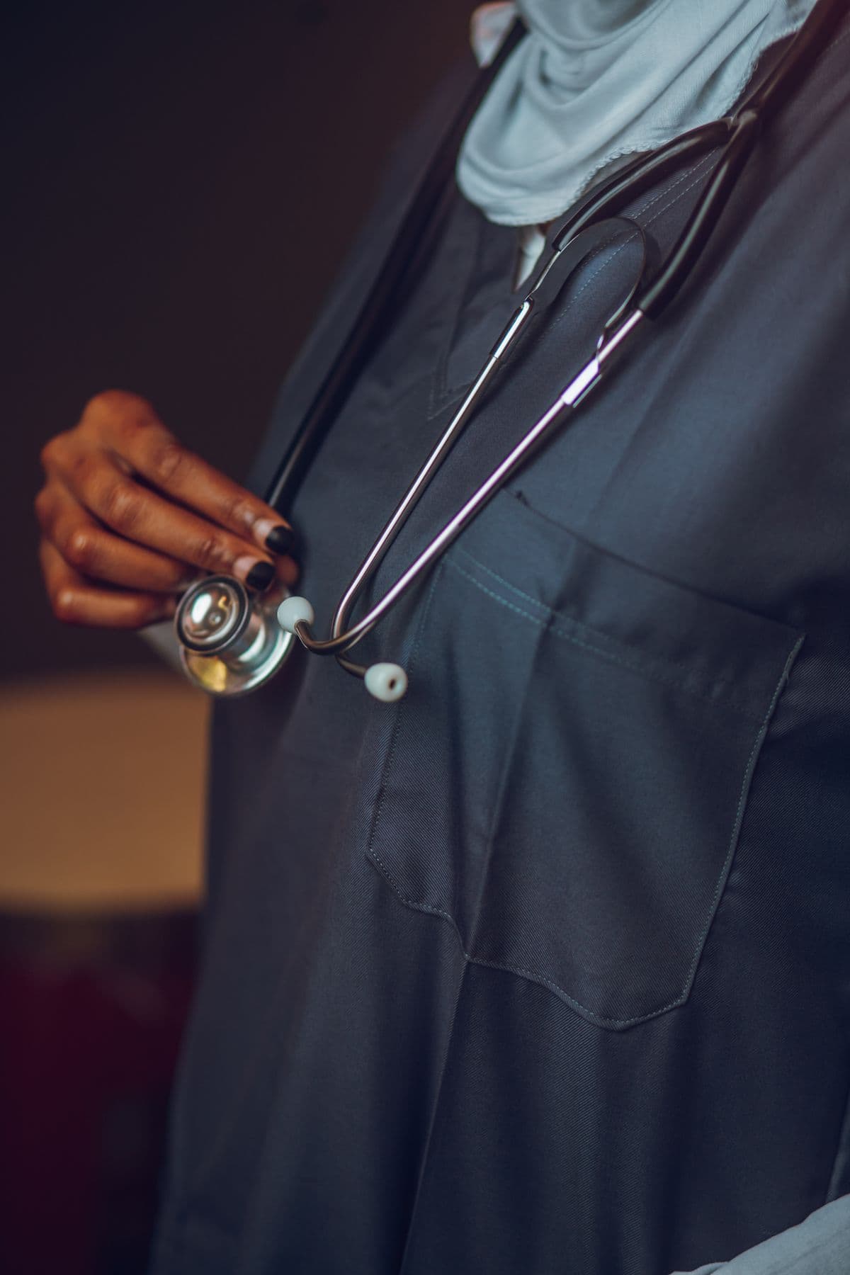 Healthcare professional holding a stethoscope
